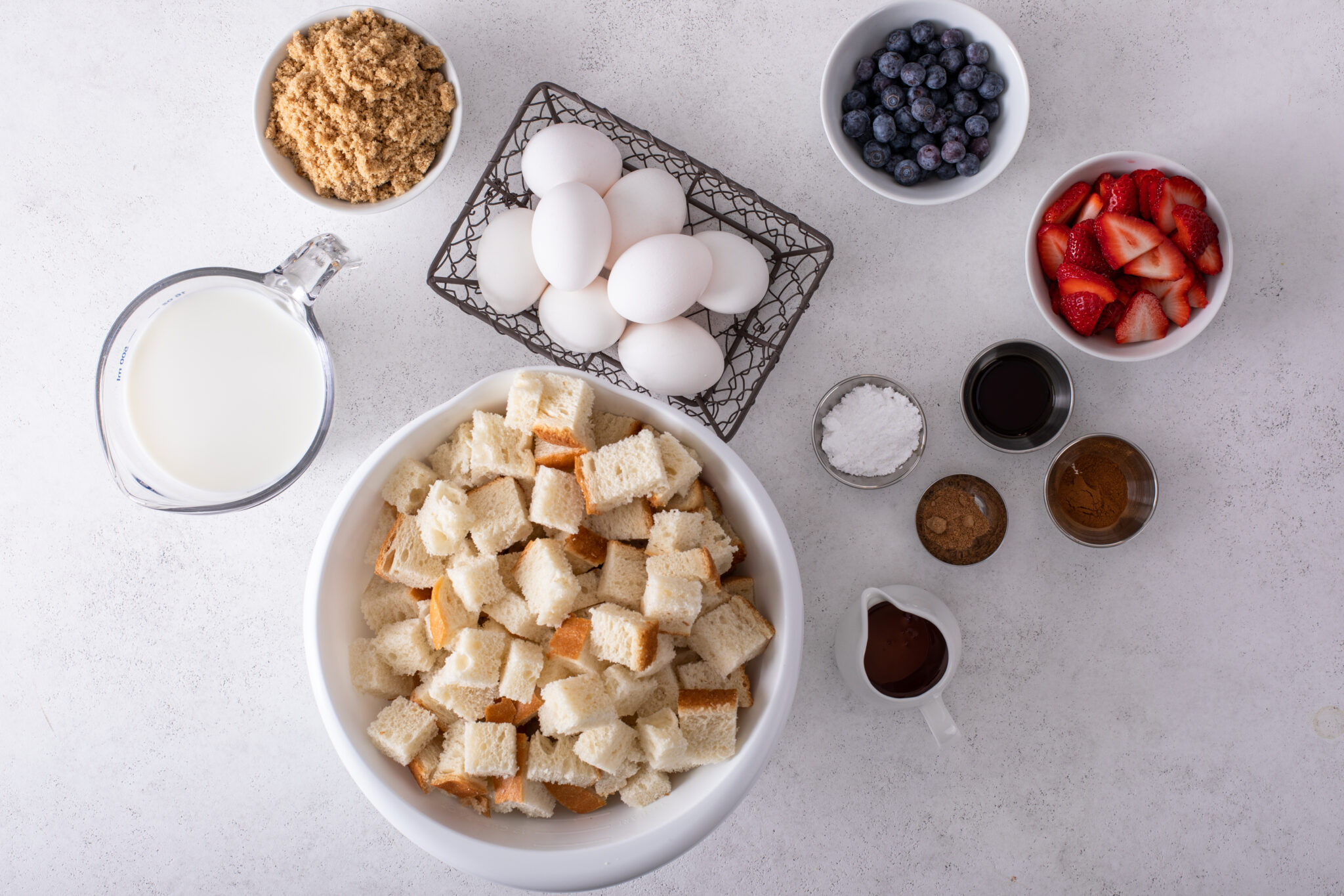 Ingredients for Very Berry French Toast Casserole flat lay shot