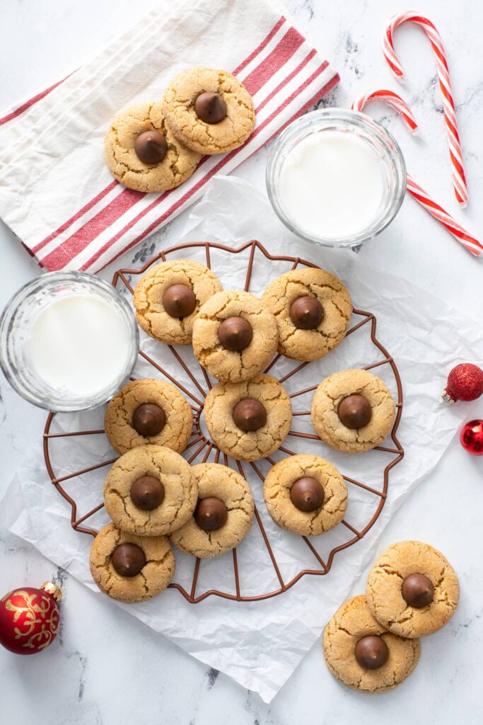 Peanut Butter Blossoms served in a holiday theme set up
