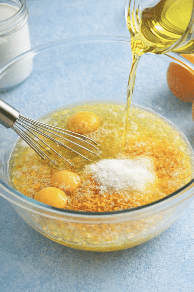 olive oil and other wet ingredients mixed for Orange-Scented Olive Oil Bundt Cake