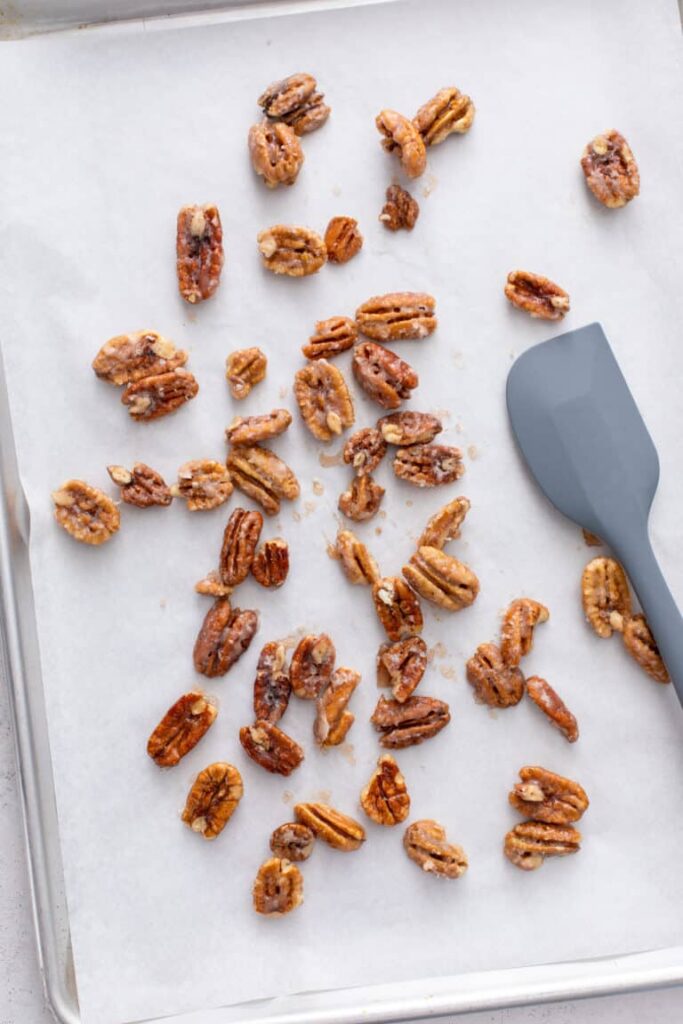 first step to make Pear & Gorgonzola Salad with Candied Pecans is preparing candied pecans