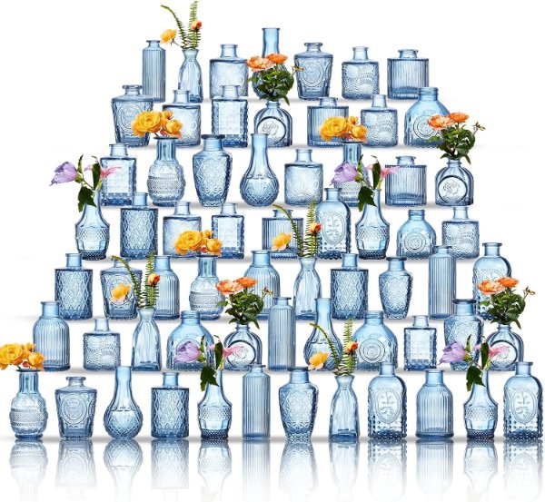 Assorted small blue glass bud vases