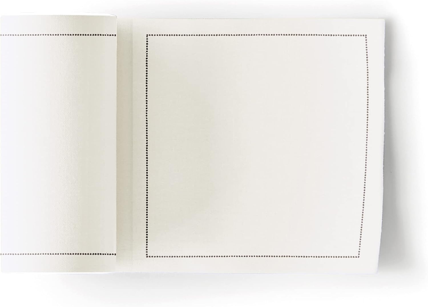 A stack of folded cream cotton cocktail napkins