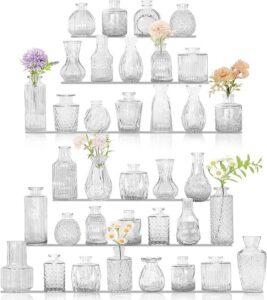 Set of small clear glass bud vases in assorted vintage shapes