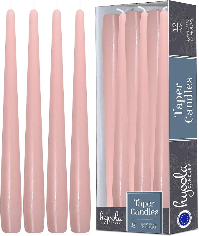 Twelve tall light pink unscented dripless taper candles