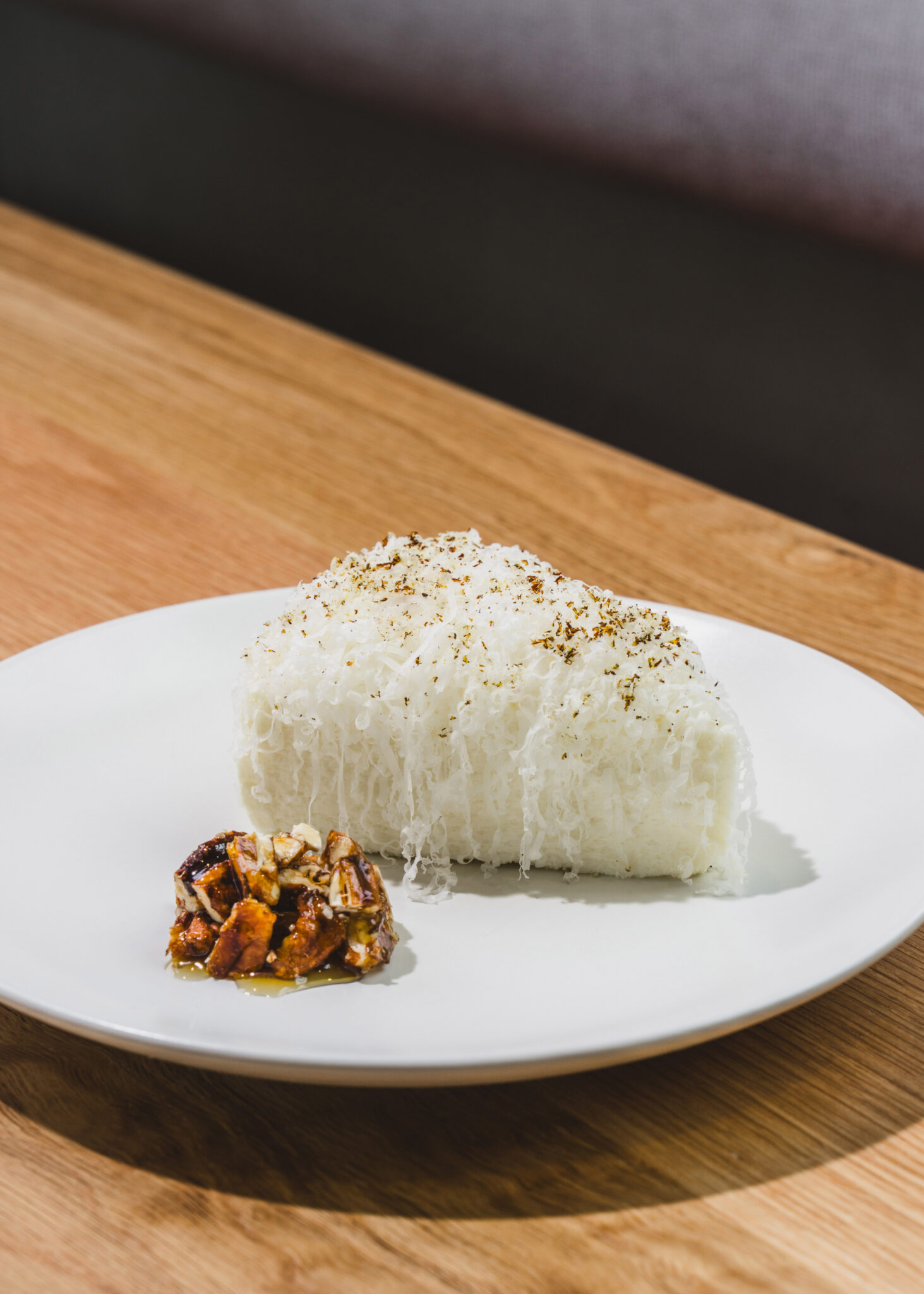 A piped marshmallow dessert on a white plate at So. Fox in Atlanta