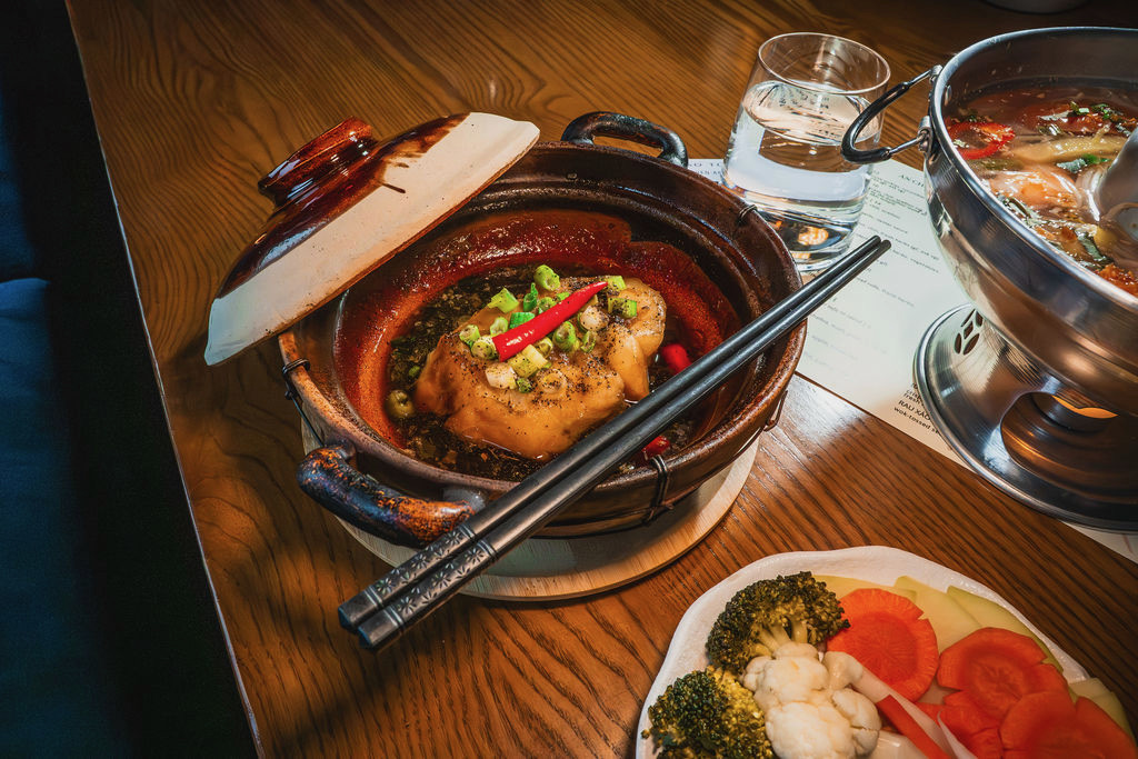 A clay pot dish with chopsticks at Bao Toan Kitchen & Bar in Memphis