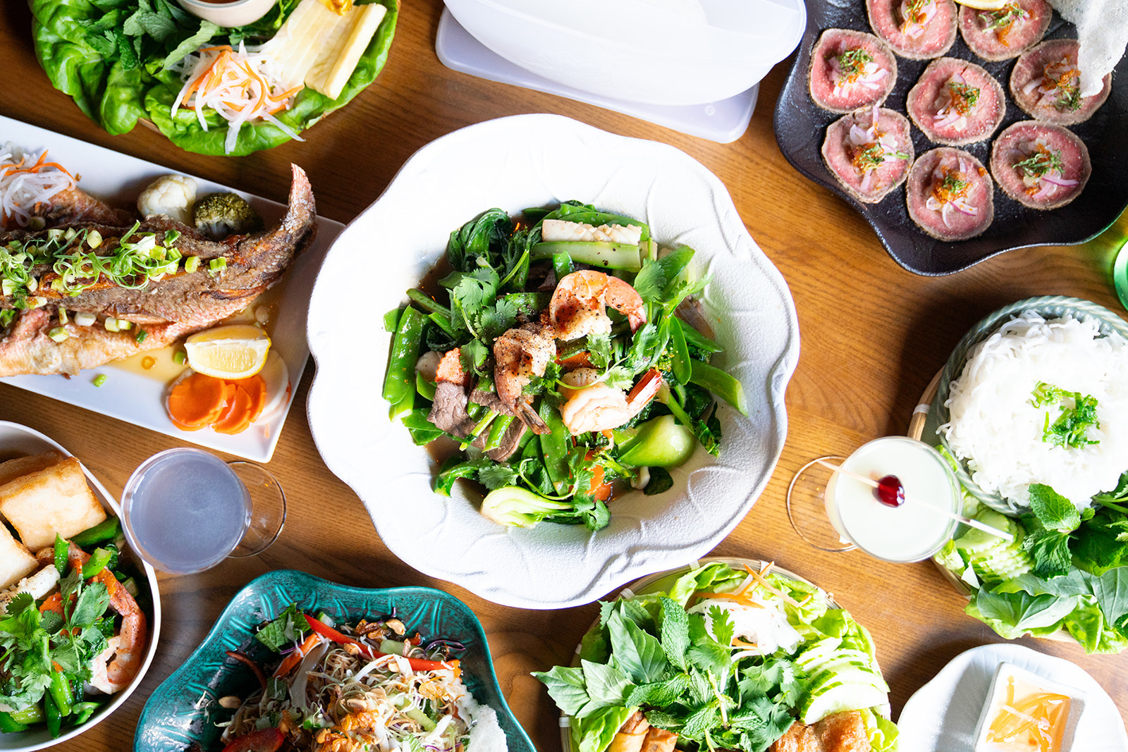 An overhead spread of Vietnamese dishes shared at Bao Toan Kitchen & Bar in Memphis